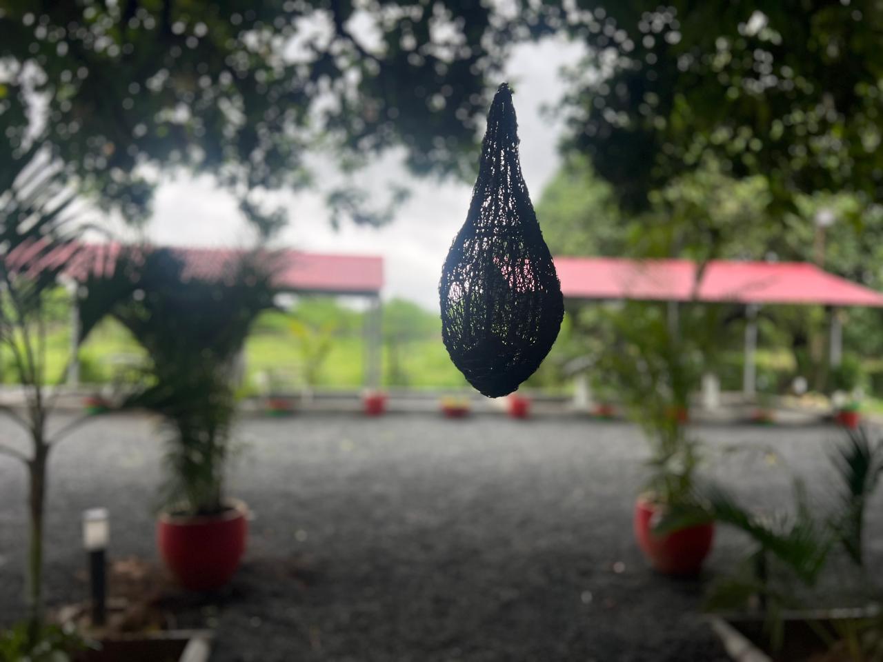 Woven hanging lamp in the garden